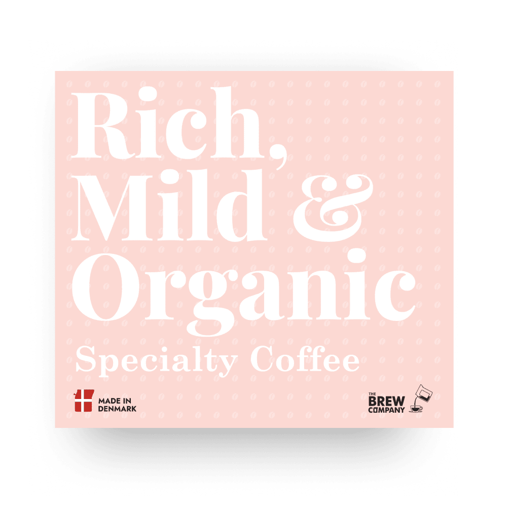 Coaster with 'Rich, Mild & Organic Specialty Coffee' text and branding on a pink background