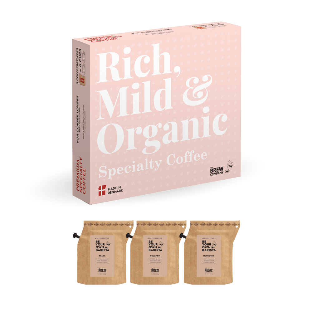 Coaster with 'Rich, Mild & Organic Specialty Coffee' text and branding on a pink background